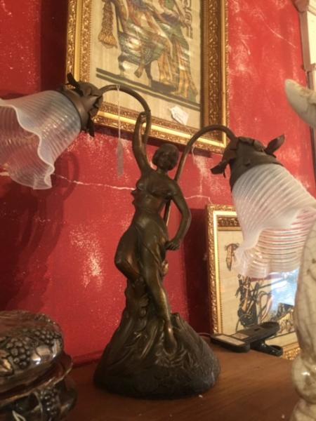 Looking for a unique piece to stand out in your home? Then try for an antique figurine lamp! 